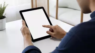 User submitting online form on tablet