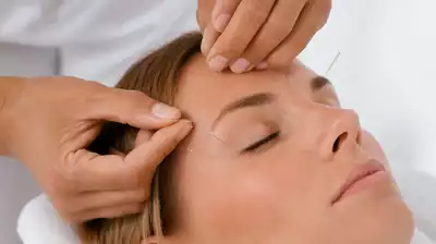 User receiving eye acupuncture treatment